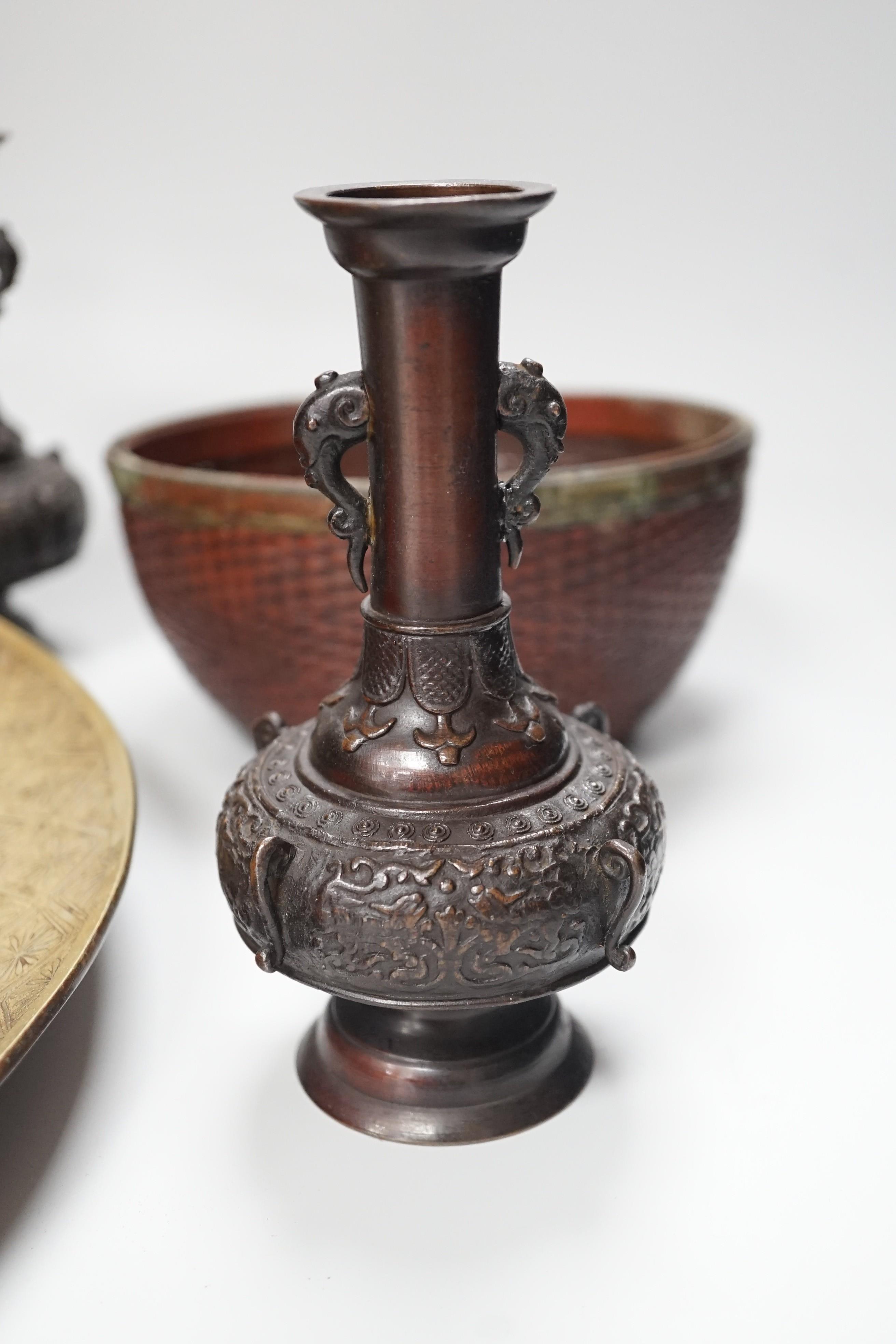 A Japanese Meiji period polished bronze dish, two hanging scroll weights, a mixed metal basket and a pair of bronze vases, dish diameter 37cm